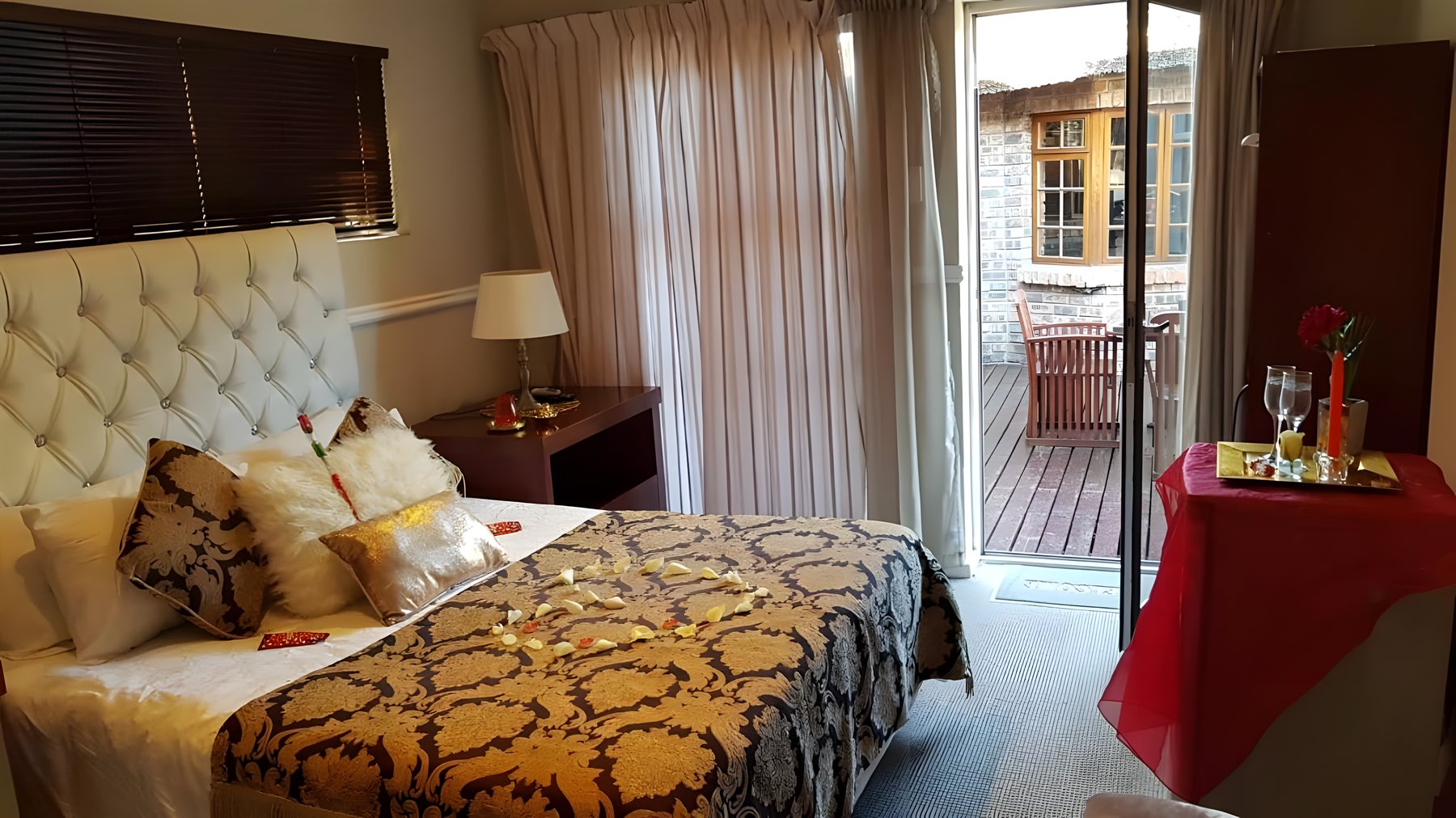 An elegant bedroom opening onto the patio