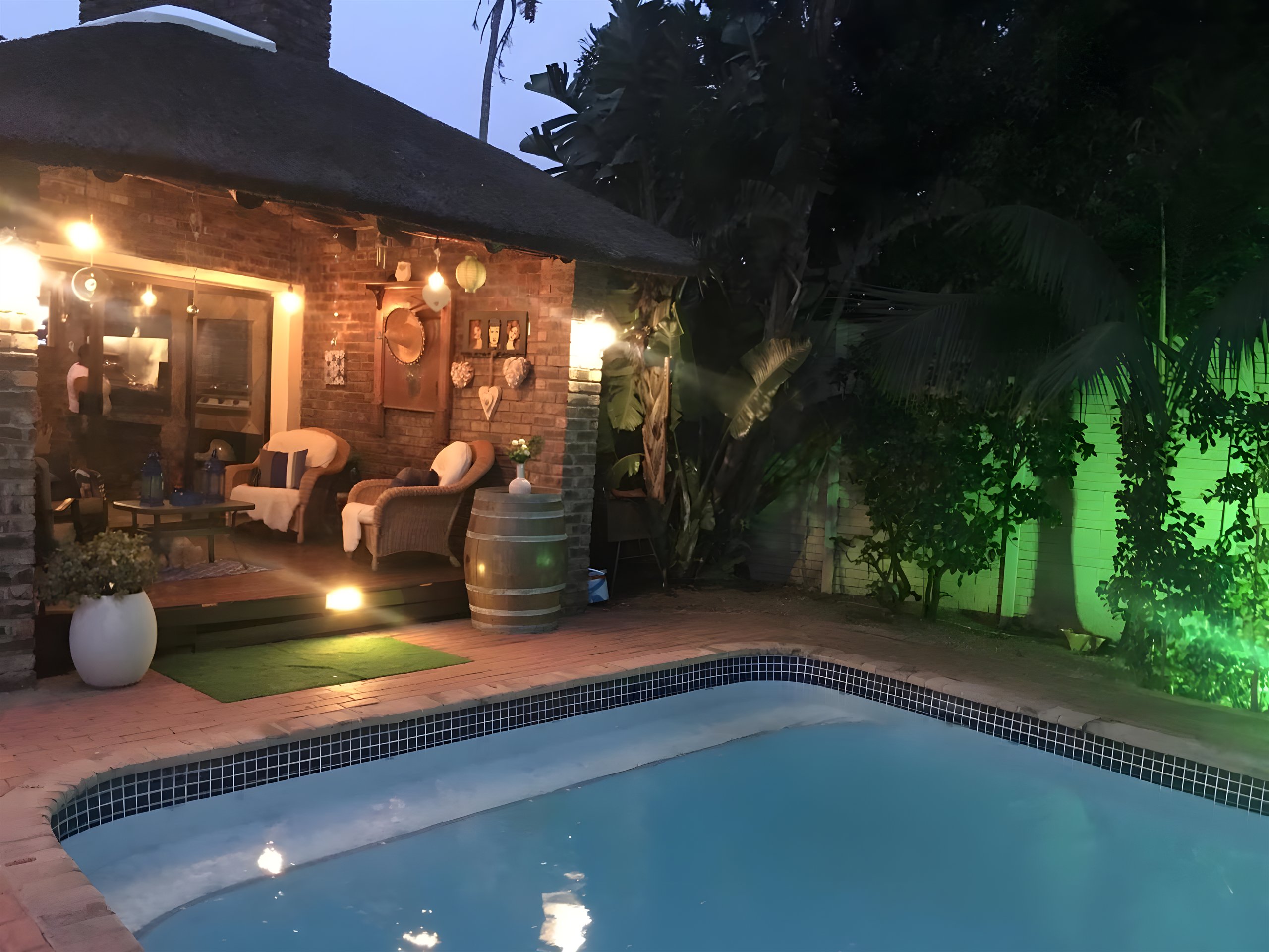 A braai lit at dusk on the patio at Walmer Heights