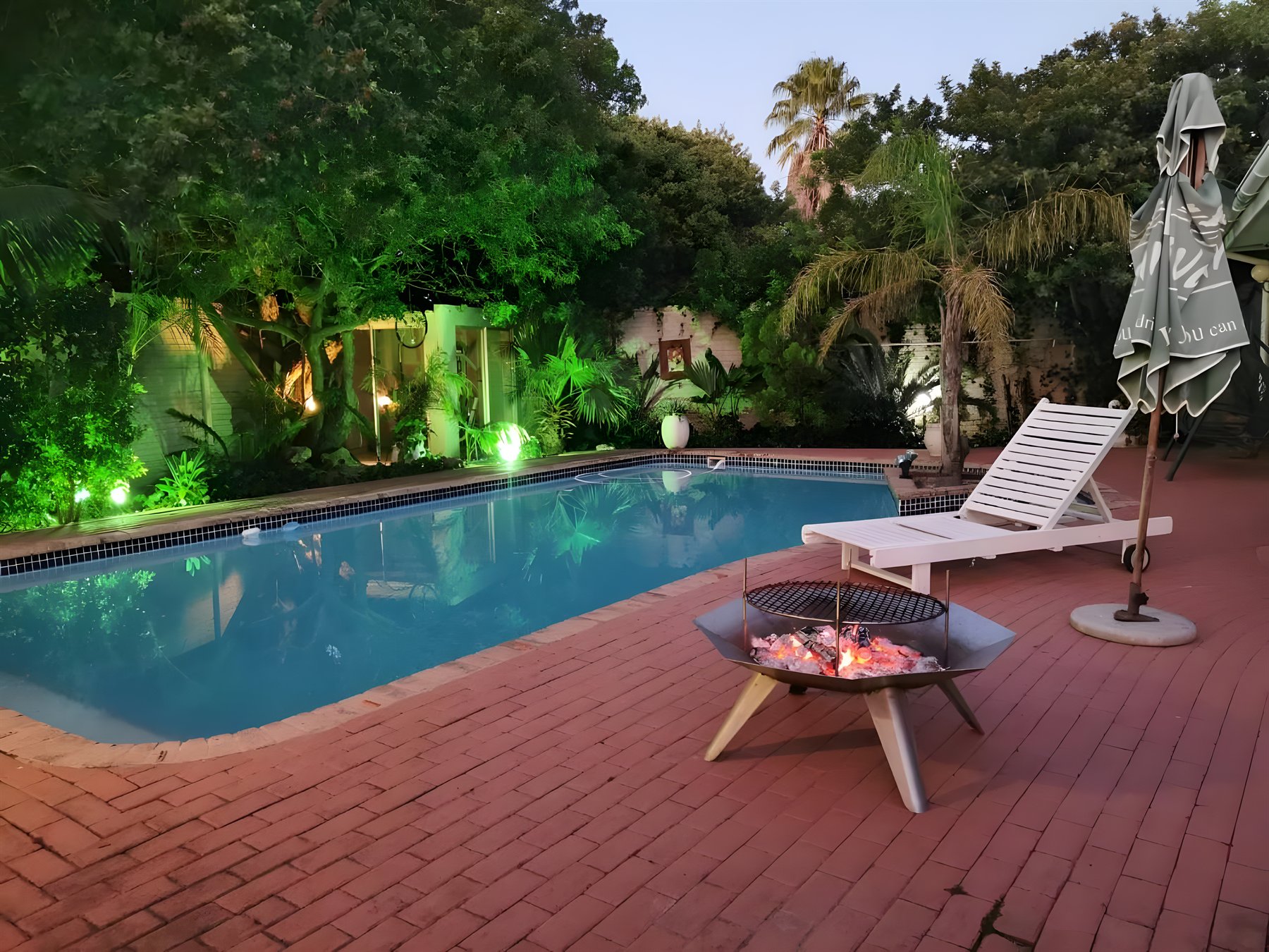 The heated outdoor pool and garden at Walmer Heights