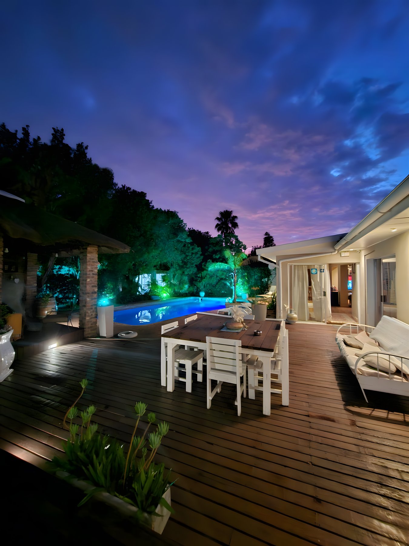 Palms over the pool at dusk